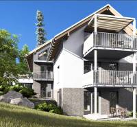 The exterior of an apartment building in the High Tatras with a garden and spacious balconies.