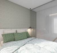 A bedroom with a bed and a built-in wardrobe in a studio apartment with soft lighting.