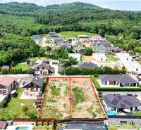 Plots - housing on Pod Agátmi Street in Štitáre, surrounded by greenery and houses.