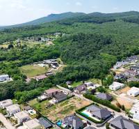 Aerial view of residential plots between streets and greenery in Štitáre on Pod Agátmi.