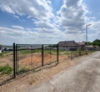 Lands - housing in the location Štitáre, Pod Agátmi. Available plot with fencing.