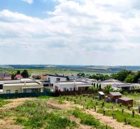 View of the surrounding landscape from residential plots in Štitáre on Pod Agátmi Street.