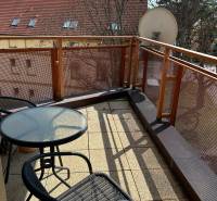 A balcony with seating in a 2-room apartment on Štefánikova Street in Poprad.