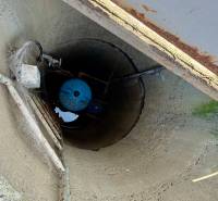 A view into a well with a metal pipe at a family house in Suchá nad Parnou, Nové vinohrady.