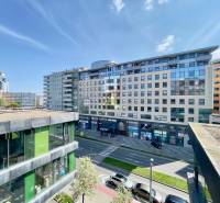 View of Košická Street with shops and apartment buildings in Bratislava - Nivy.