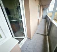 A balcony in a 3-room apartment with a view of the countryside in Bánovce nad Bebravou.