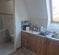 Kitchen corner with wood decor, toilet, interior of commercial premises.