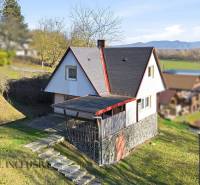 A cottage on Kováčov Street in Štúrovo with a grassy plot and a view of the surrounding countryside.