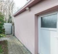 A family house in Šurany with a pink facade and white doors.