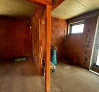 Interior of a family house with a brick wall and installation work.