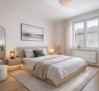 Bedroom with wood-patterned flooring, a bed, and a nightstand in a family house.