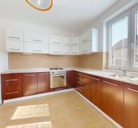 A kitchen in a family house with a wooden decor countertop and floor.