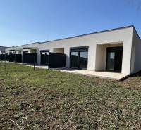 A family house in Klasov with a terrace and garden, separated by a fence.
