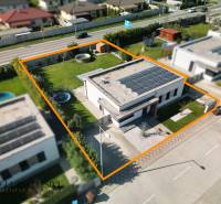 A family house in Dunajská Streda with a large garden, a trampoline, and solar panels on the roof.