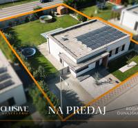 Family house for sale in Dunajská Streda with a lawn and solar panels.