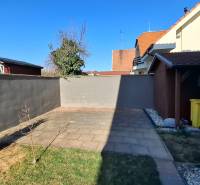 A courtyard with paving and lawn in a 3-room apartment on Nitrianska Street in Nitra.