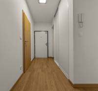 A corridor with white walls and a wooden decor floor in a 2-room apartment.