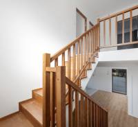 Interior of a family house with a staircase and a wooden decor floor.