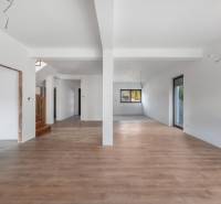 Interior of a family house with an open space and a wooden decor floor.