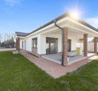 A family house in Vojka nad Dunajom with a landscaped garden and a covered terrace.