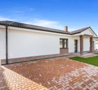 Family house in Vojka nad Dunajom, brick walls and a pitched roof.