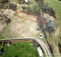 Plots - housing in Vydrná, bordered in red, near the road and tree.