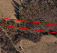 Agricultural and forest lands near Námestovo, bordered by a red line, in the autumn season.