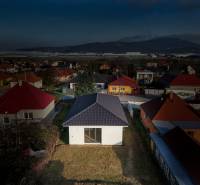 A family house on Rastislavova Street in Lužianky surrounded by other houses and greenery.