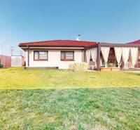 A family house on Maria Theresa Street in Holíč with a glazed terrace and a landscaped garden.