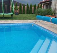The family house on Maria Theresa Street in Holíč features a pool and a lawn.