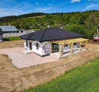 A family house in Harichovce with a terrace and a veranda, set in nature.