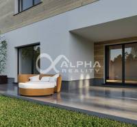 A family house in Harichovce with a terrace, comfortable seating, and wooden decor on the facade.