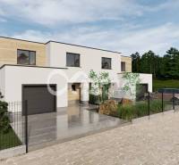 A family house in Harichovce with a garage and green surroundings.