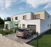 A family house in Harichovce, a modern building with a garage and surroundings full of greenery.