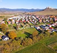 Aerial view of residential plots in Spišské Podhradie with a view of the castle.