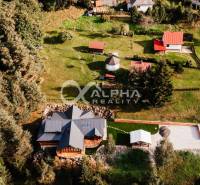 A family house in Hnilčík surrounded by greenery and forest, in a peaceful rural environment.