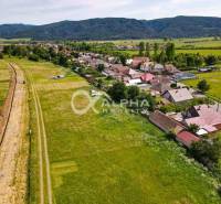 Plots - housing in Betlanovce with a view of the surrounding hills and village buildings.