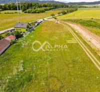Land - housing in Betlanovce, green landscape with a road and a house.