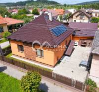 A family house in Spišská Nová Ves, with a brown roof and solar panels.
