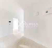 A spacious hallway in a 3-room apartment with white walls and light flooring.