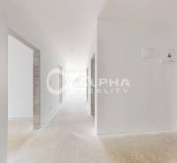 A bright hallway with white walls in a 3-room apartment.