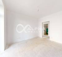 Interior with white walls and floor, spacious room in a 3-room apartment.