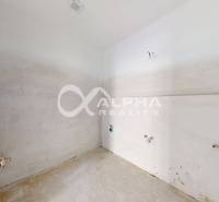 Unfurnished interior of a 3-room apartment with prepared connections for electrical installation and water.