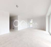 Spacious interior of a 3-room apartment with large windows and light-colored walls.