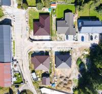 Aerial view of the building development in Spišská Nová Ves, including houses and roads.