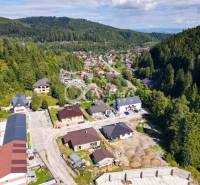 An aerial view of a picturesque neighborhood surrounded by forests in Spišská Nová Ves.
