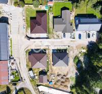 A top-down view of residential houses and roads in Spišská Nová Ves.