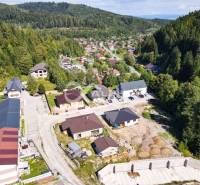 A summer view of a picturesque district in Spišská Nová Ves surrounded by wooded hills.