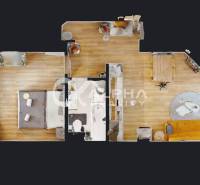 Floor plan of a 2-room apartment with wood-patterned flooring and furniture.