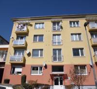 Apartment building in Prešov on 17. novembra Street with balconies and satellites.